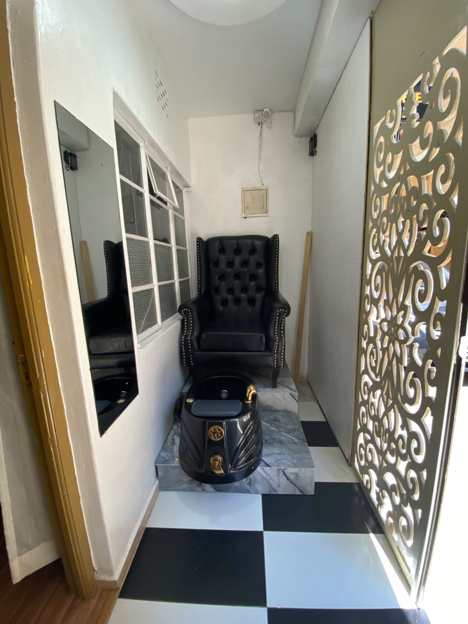 Pedicure and nail chair with checkered floor