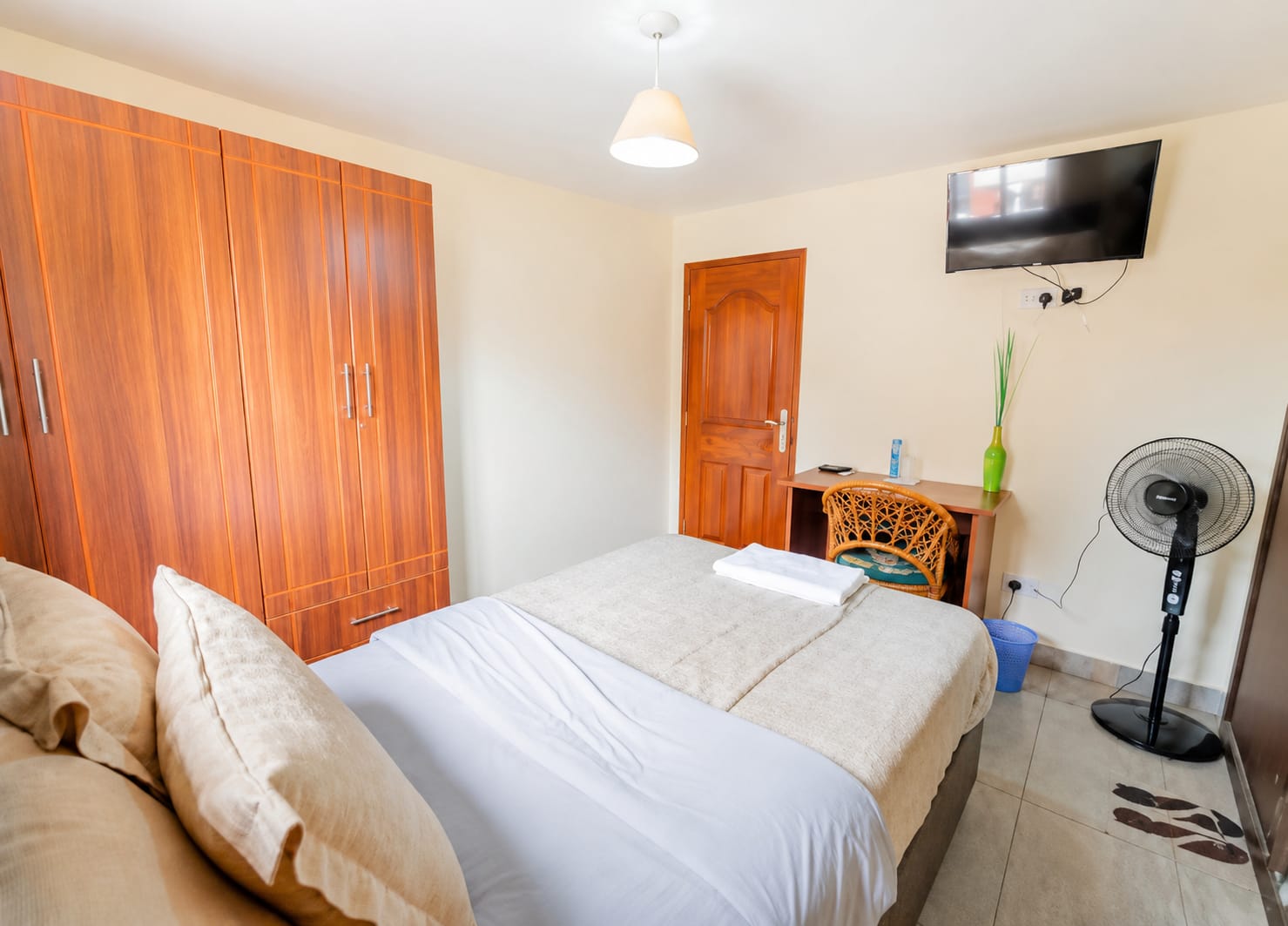 Spa treatment room with massage bed and shower cubicle