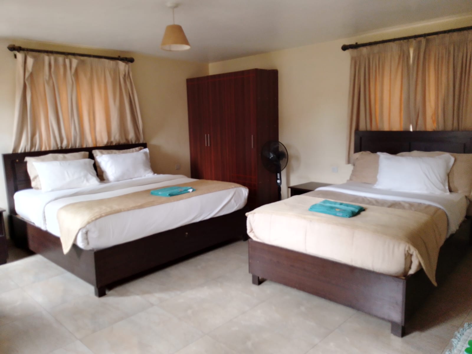 Twin double room with two beds and wardrobe